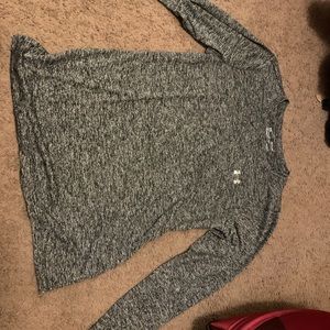 grey long sleeved under armour workout shirt